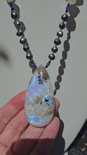 Load and play video in Gallery viewer, Sea Witch New Moon Necklace - Rainbow Moonstone
